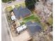 Aerial view showcasing the home's well-maintained yard, brick home, RV parking and the detached garage with ample space at 795 N Jersey St, Denver, CO 80220
