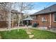 Private backyard with a gazebo, lush lawn, and inviting patio area at 795 N Jersey St, Denver, CO 80220