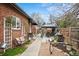 Relaxing backyard oasis with a comfortable seating area, grill and lush landscaping, ideal for outdoor entertaining at 795 N Jersey St, Denver, CO 80220