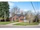 Charming brick home with a well-maintained lawn, mature trees, and inviting curb appeal at 795 N Jersey St, Denver, CO 80220