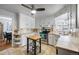 Well-lit kitchen with white cabinets, stainless steel appliances, and an island with space for cooking at 795 N Jersey St, Denver, CO 80220