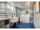 Functional laundry room with sink, washer, dryer, and ample storage at 795 N Jersey St, Denver, CO 80220