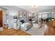 Inviting living room with hardwood floors, a plush sectional sofa, and ample natural light at 795 N Jersey St, Denver, CO 80220