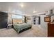 Relaxing main bedroom with large bed, carpeted floor, and recessed lighting at 795 N Jersey St, Denver, CO 80220