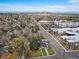 The home sits amid a vibrant neighborhood and offers a beautiful view of the nearby skyline and a manicured lawn at 795 N Jersey St, Denver, CO 80220