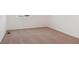 Empty bedroom featuring neutral carpet, white walls, and ample natural light at 8339 Snake River St, Littleton, CO 80125