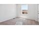 Bedroom with plush carpeting and a window showcasing the neighborhood at 8339 Snake River St, Littleton, CO 80125
