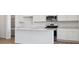 Bright kitchen featuring stainless steel appliances and a large center island with bar seating at 8339 Snake River St, Littleton, CO 80125