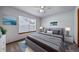 Neutral bedroom features a large window, grey accents, and modern decor at 5416 S Hannibal Ct, Centennial, CO 80015