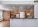 Open kitchen with ample cabinets, granite countertops, a breakfast bar, and stylish backsplash at 5416 S Hannibal Ct, Centennial, CO 80015