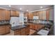 Updated kitchen boasts granite countertops, stainless appliances, and plenty of cabinet space at 5416 S Hannibal Ct, Centennial, CO 80015