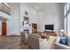 Inviting living area with fireplace, hardwood floors, and comfortable seating creates a cozy atmosphere for relaxation and entertainment at 5416 S Hannibal Ct, Centennial, CO 80015