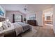 Serene main bedroom featuring a large window, plush carpet, and access to an en-suite bathroom at 5416 S Hannibal Ct, Centennial, CO 80015