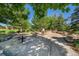 Picnic area featuring tables, grills, mature trees, and a walking path for outdoor gatherings and recreation at 5416 S Hannibal Ct, Centennial, CO 80015