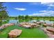 Scenic pond with rocks, trees, and lush greenery, creating a tranquil outdoor oasis for relaxation at 5416 S Hannibal Ct, Centennial, CO 80015