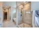 This primary bathroom features a frameless glass shower, soaking tub, and neutral, calming tones at 10526 Fairhurst Way, Highlands Ranch, CO 80126
