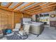 Relax in this backyard hot tub featuring a wooden pergola, privacy walls, and patio furniture at 10526 Fairhurst Way, Highlands Ranch, CO 80126