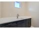 Laundry room featuring dark cabinets, light countertops, undermount sink, and ample counter space at 10526 Fairhurst Way, Highlands Ranch, CO 80126