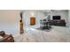 Spacious living area with carpet, a ceiling fan, a dining table, and comfortable seating at 10526 Fairhurst Way, Highlands Ranch, CO 80126