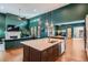 Open-concept living space with a fireplace, vaulted ceilings, and seamless integration with the gourmet kitchen at 10526 Fairhurst Way, Highlands Ranch, CO 80126
