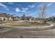 Neighborhood street view featuring landscaped yards and well-kept homes in a suburban community at 10526 Fairhurst Way, Highlands Ranch, CO 80126