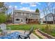 Spacious backyard with a patio, lush grass, and a well-maintained garden, perfect for outdoor enjoyment and relaxation at 5310 S Flanders Way, Centennial, CO 80015
