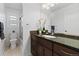 Bright bathroom features a dark vanity and granite countertop at 5310 S Flanders Way, Centennial, CO 80015