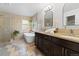 Luxurious bathroom with double vanity, soaking tub, and walk-in shower at 5310 S Flanders Way, Centennial, CO 80015