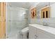 Elegant bathroom featuring a glass-enclosed shower, a stylish vanity, and modern fixtures at 5310 S Flanders Way, Centennial, CO 80015