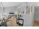 Bright foyer with a view into the living room featuring a staircase and hardwood floors at 5310 S Flanders Way, Centennial, CO 80015