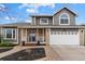 Charming two-story home featuring a well-manicured yard and brick accents at 5310 S Flanders Way, Centennial, CO 80015