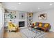 Cozy living room with built-in shelving and modern furniture at 5310 S Flanders Way, Centennial, CO 80015