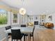 Bright and airy living room with fireplace and dining area at 5310 S Flanders Way, Centennial, CO 80015