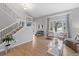 Bright living room featuring a staircase, hardwood floors, and neutral-toned furniture at 5310 S Flanders Way, Centennial, CO 80015
