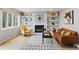 Comfortable living room featuring a fireplace and built-in shelves at 5310 S Flanders Way, Centennial, CO 80015