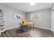 Home office with wood-style flooring and natural light at 5310 S Flanders Way, Centennial, CO 80015