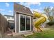 Backyard playhouse featuring a slide, providing a fun and engaging outdoor play area for children at 5310 S Flanders Way, Centennial, CO 80015