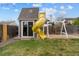 Backyard playhouse with slide and swing set, offering an inviting space for outdoor fun and recreation at 5310 S Flanders Way, Centennial, CO 80015