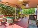 View of the back deck, featuring an outdoor seating area and a grill at 12899 W Aqueduct Ave, Littleton, CO 80127