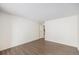 Bedroom featuring modern flooring with entry to hallway and doorway to bathroom at 2225 Buchtel Blvd # 208, Denver, CO 80210