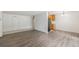 Open living room featuring both tile and modern flooring adjacent to kitchen at 2225 Buchtel Blvd # 208, Denver, CO 80210