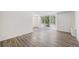 Bright living room featuring modern flooring and a sliding glass door to a balcony at 2225 Buchtel Blvd # 208, Denver, CO 80210