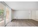 Living room features modern flooring and a sliding glass door to a balcony at 2225 Buchtel Blvd # 208, Denver, CO 80210