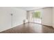 Living room features modern flooring and a sliding glass door to a balcony at 2225 Buchtel Blvd # 208, Denver, CO 80210