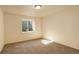 Carpeted bedroom featuring a window letting in natural light at 5782 Waverley Ave, Firestone, CO 80504