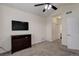 Comfortable bedroom with ceiling fan, dresser, and plenty of closet space for storage at 23070 York Ave, Parker, CO 80138