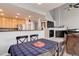 Bright dining area adjoins a cozy living room with a fireplace at 23070 York Ave, Parker, CO 80138