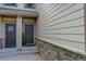 Inviting entrance with stone accents and two front doors at 23070 York Ave, Parker, CO 80138