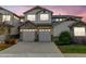 Charming townhome with stone accents and a two-car garage, perfect for modern living at 23070 York Ave, Parker, CO 80138