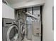 Practical laundry room with modern washer, dryer, and storage cabinets for convenience at 23070 York Ave, Parker, CO 80138
